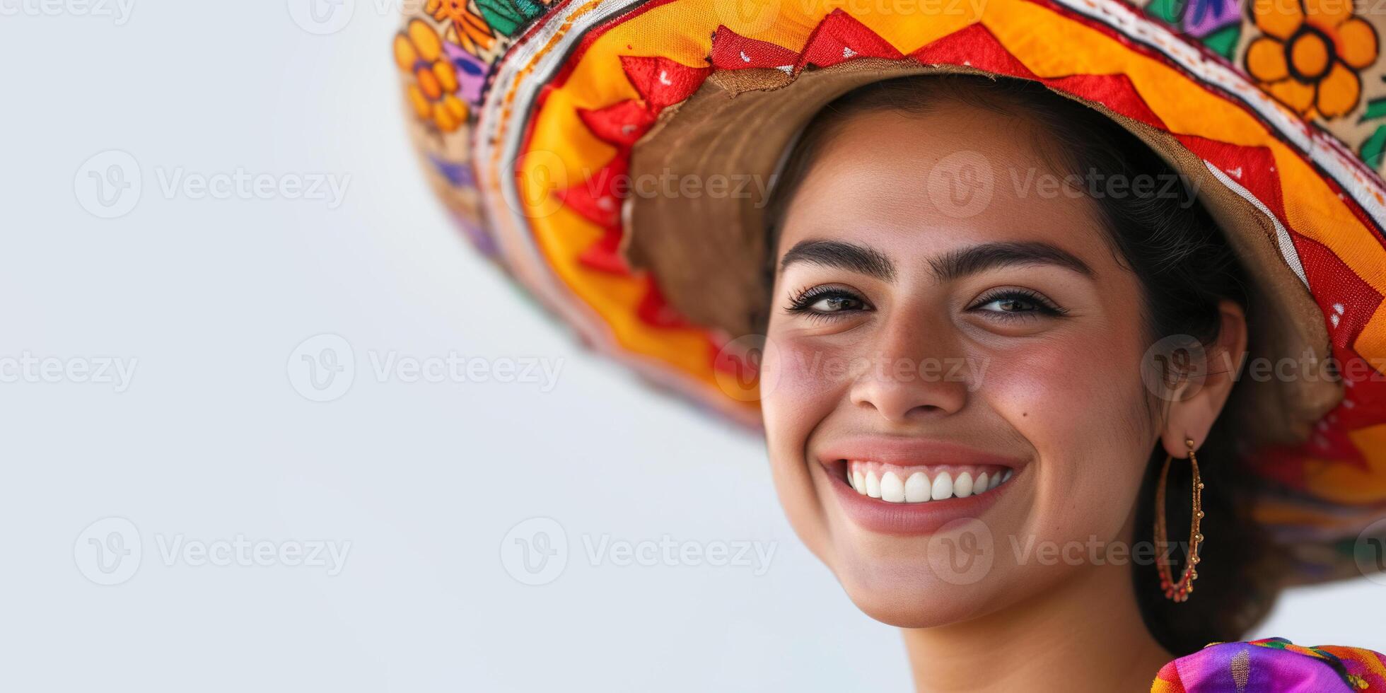Young confident Mexican woman with a sombrero smiling with copy space. Ethnic traditional outfit, Mexico culture, natural beauty, joyful positive concept photo
