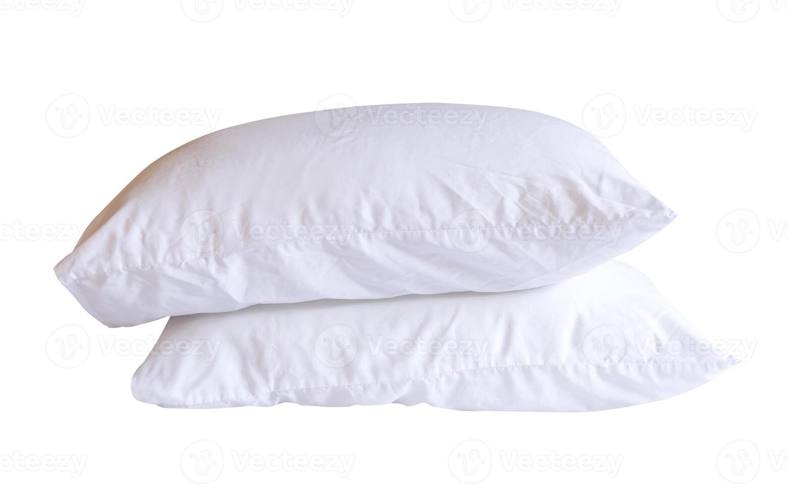 Side view of two white pillows after use in stack isolated on white background with clipping path photo