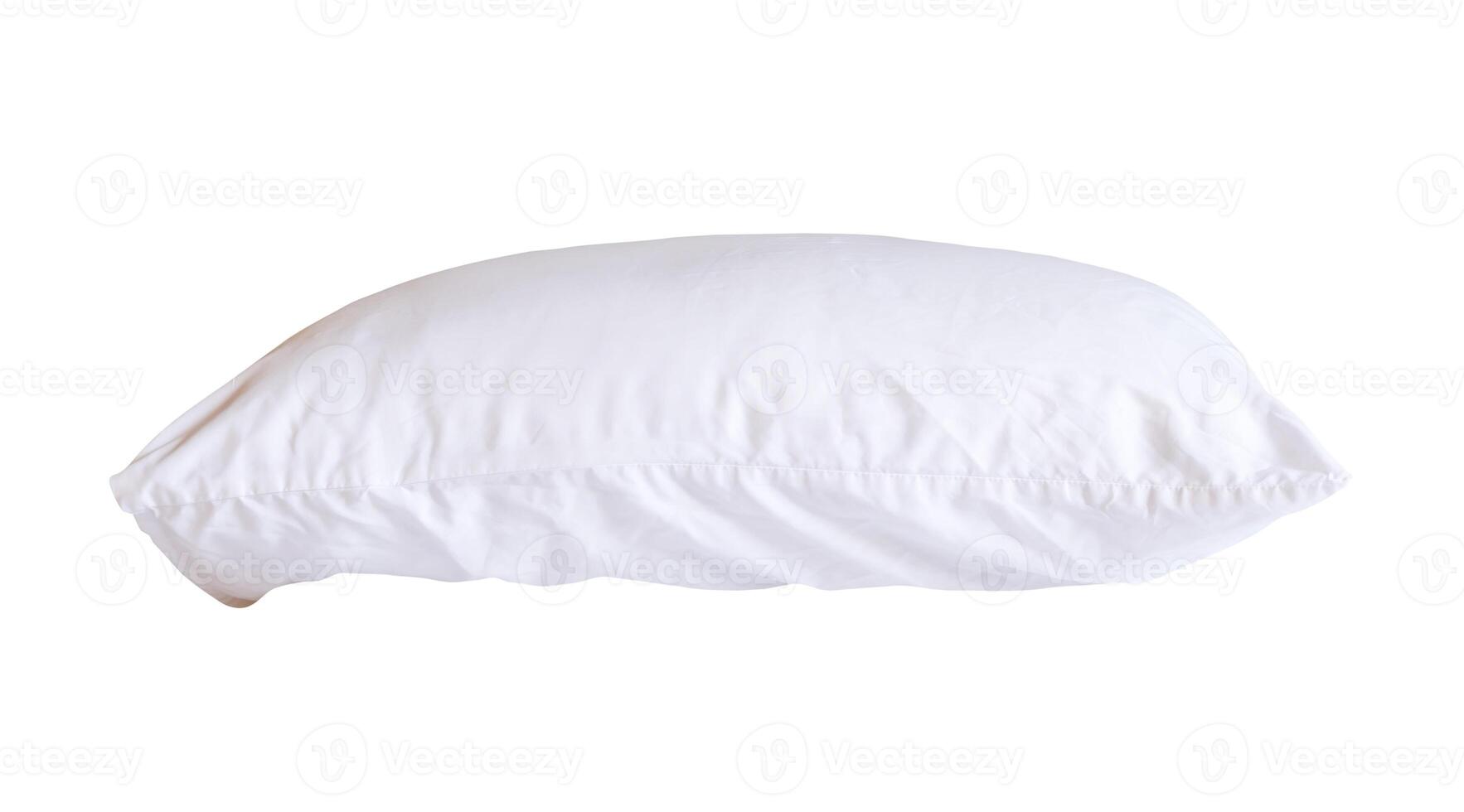 Side view of white pillow with case after guest's use in hotel or resort room isolated on white background with clipping path. Concept of comfortable and happy sleep in daily life photo