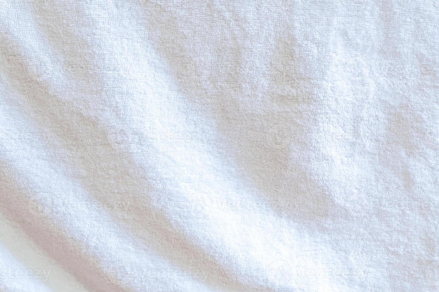Wrinkled white towel texture with wave pattern used as clothing texture in decorative art work photo