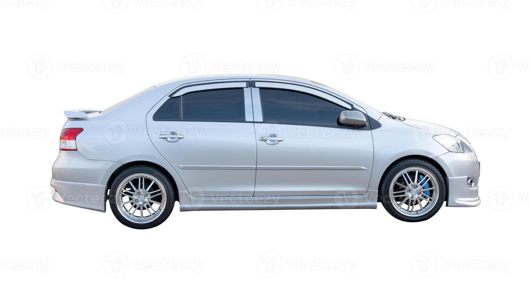 Side view of bronze sedan car isolated on white background with clipping path photo