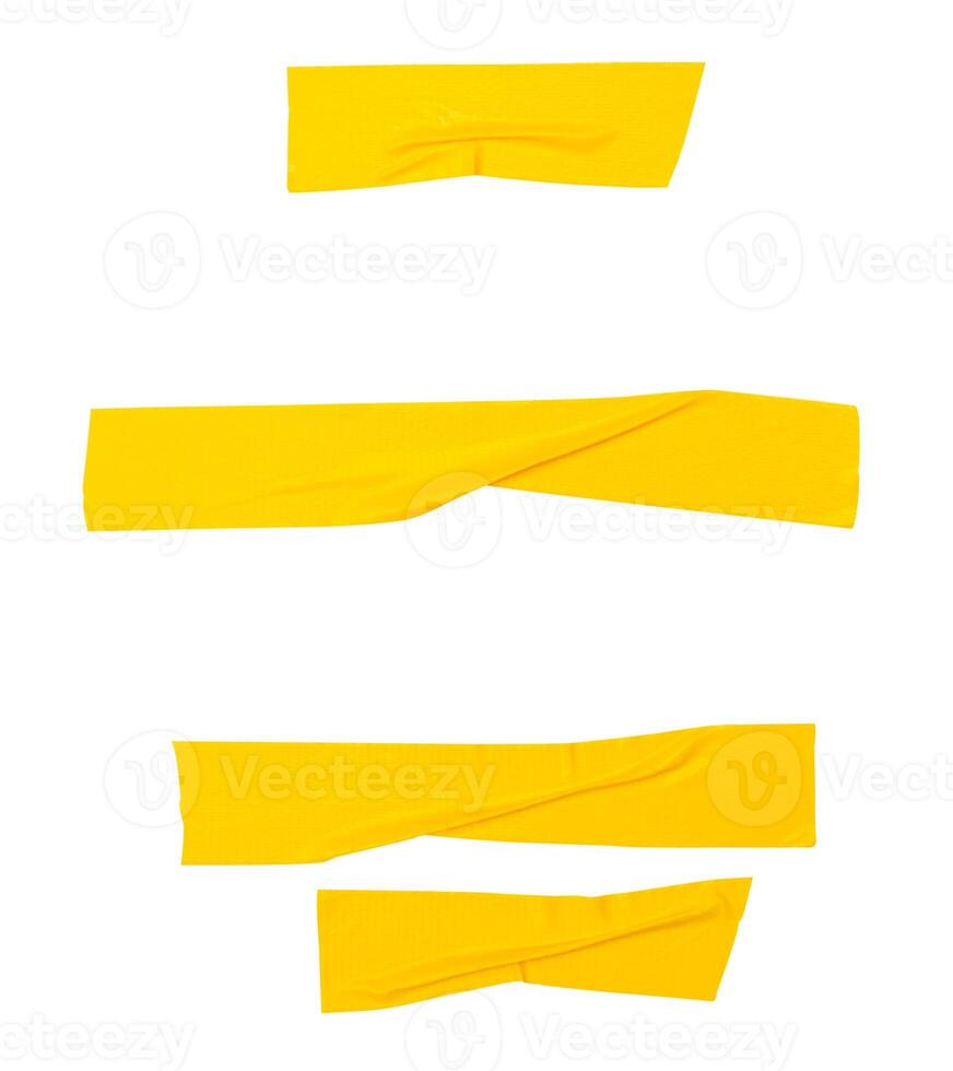 Top view set of wrinkled yellow adhesive vinyl tape or cloth tape in stripes shape isolated on white background with clipping path photo