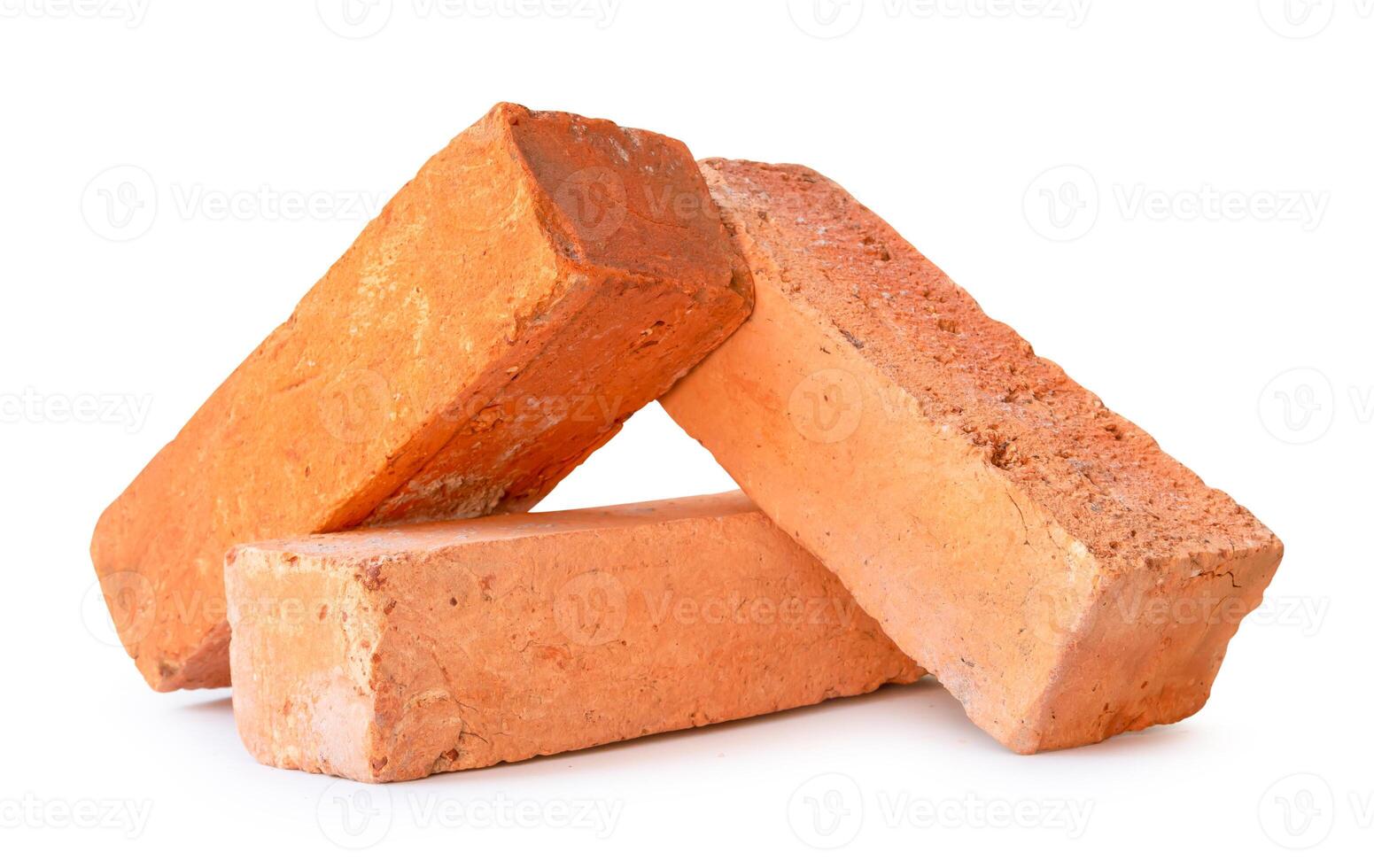 Front view of red or orange bricks in stack isolated on white background with clipping path photo