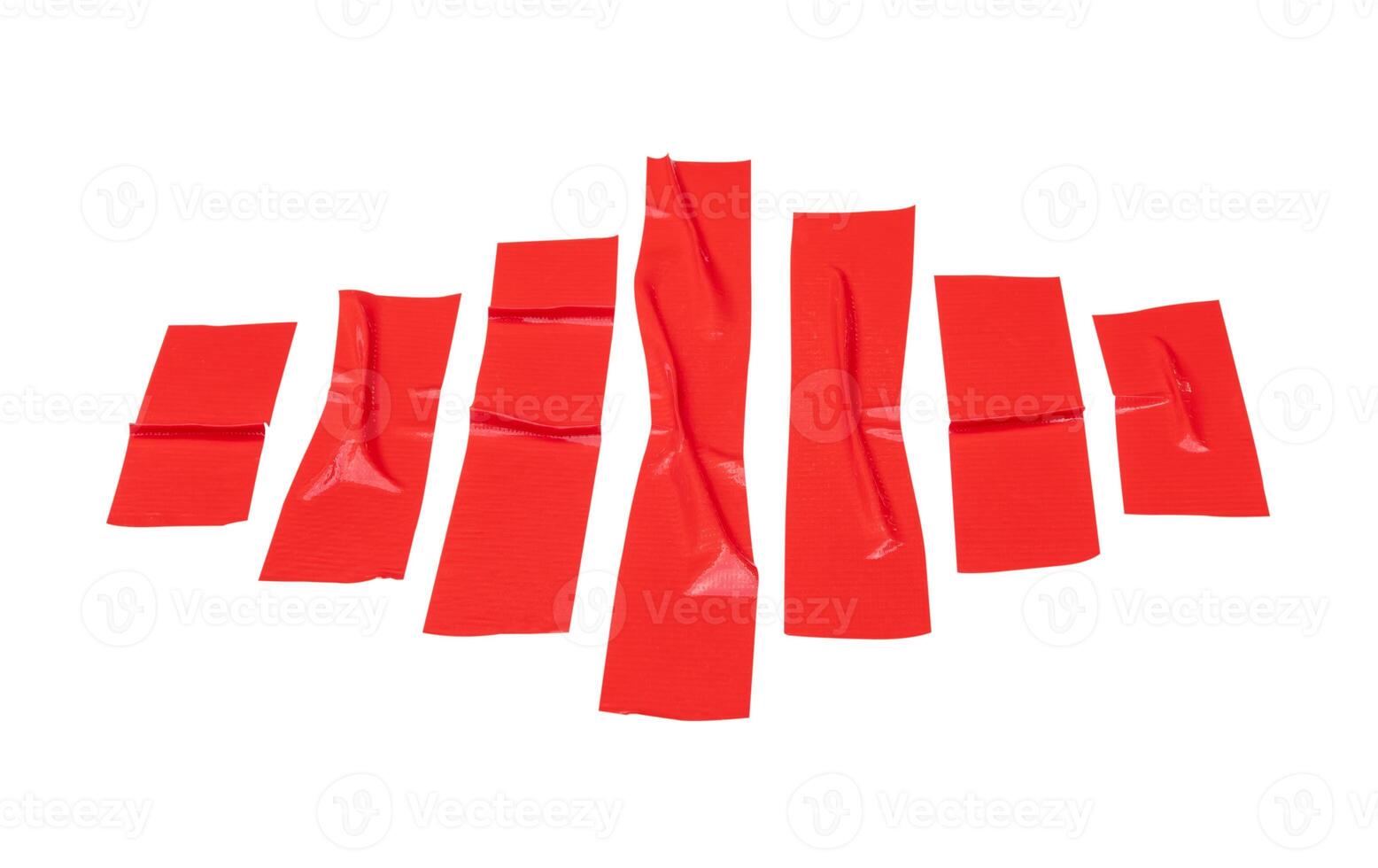 Top view set of wrinkled red adhesive vinyl tape or cloth tape in stripes isolated on white background with clipping path photo