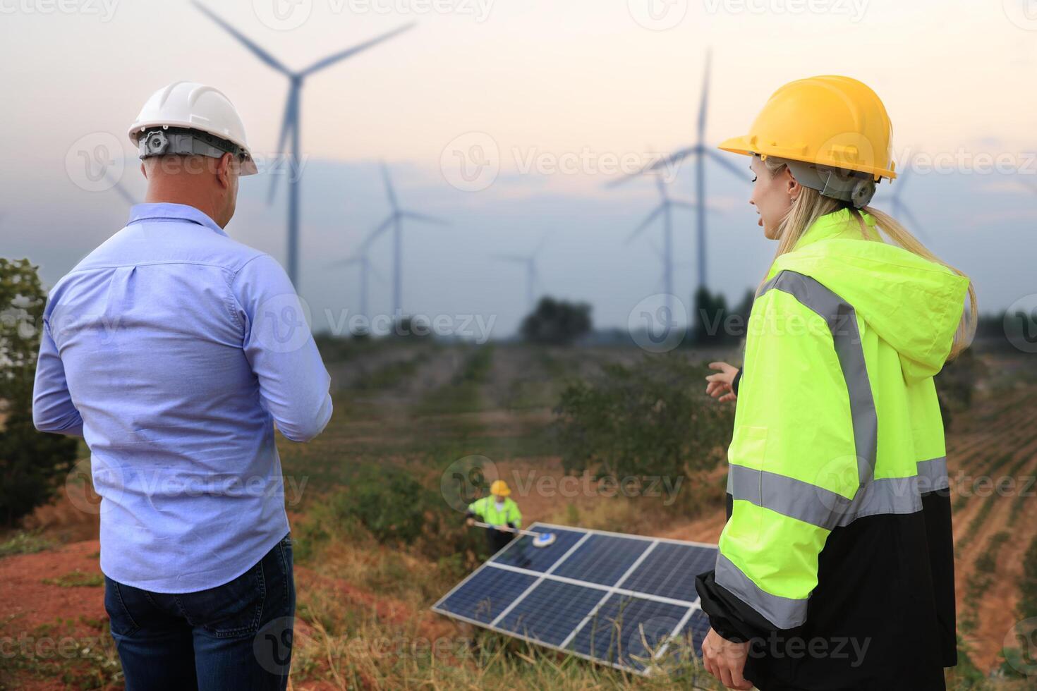 Businessman or owner check job progress of solar panel installation, sustainable and renewable energy, business discussion photo