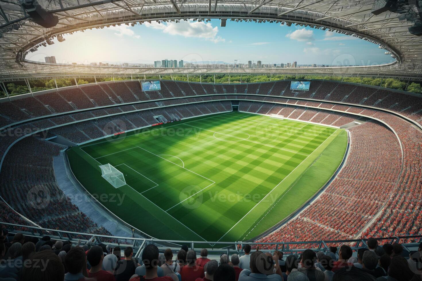 A soccer field with a large crowd of people watching the game photo