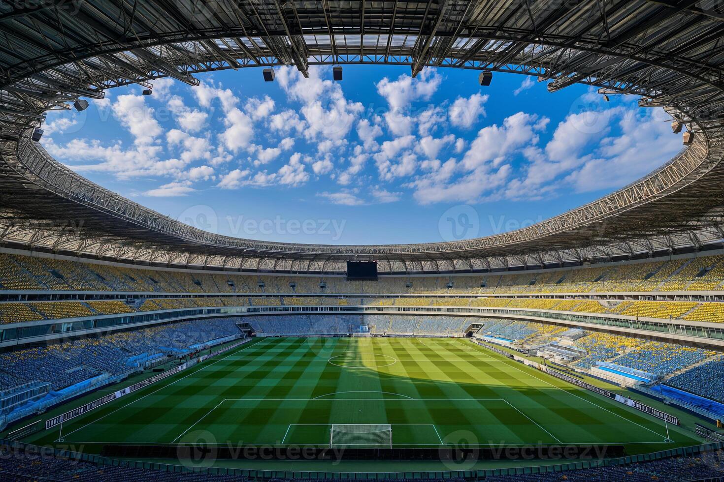 A soccer field with a large crowd of people watching the game photo