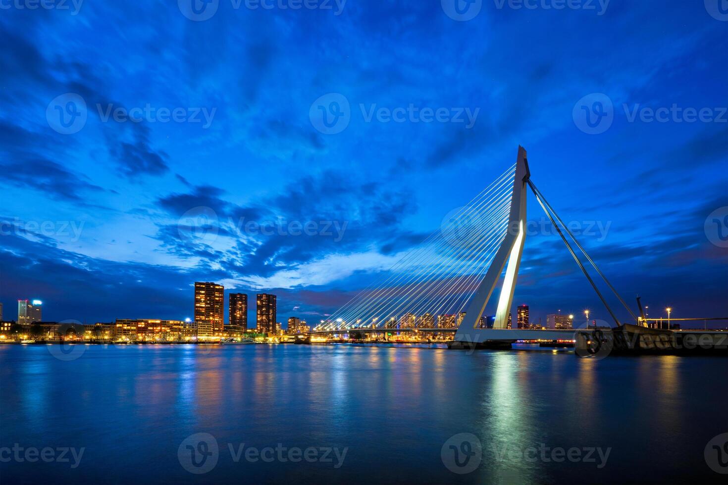 View of Erasmus Bridge Erasmusbrug and Rotterdam skyline. Rotterdam, Netherlands photo