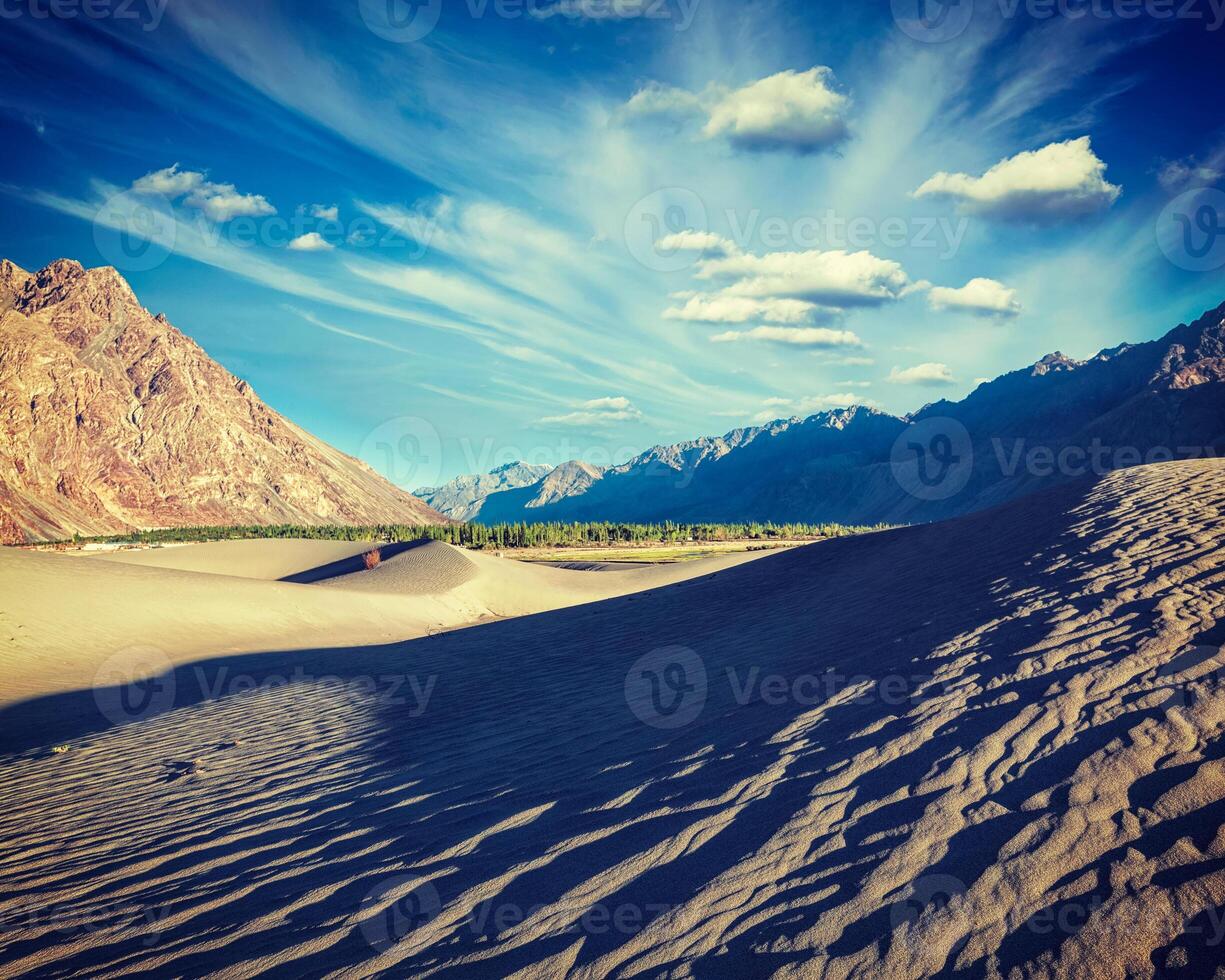 Sand dunes in mountains photo