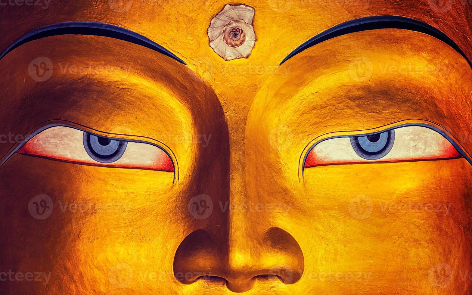 Maitreya Buddha face close up, Thiksey Gompa, Ladakh photo