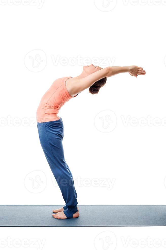 Sporty fit woman practices yoga asana Anuvittasana photo