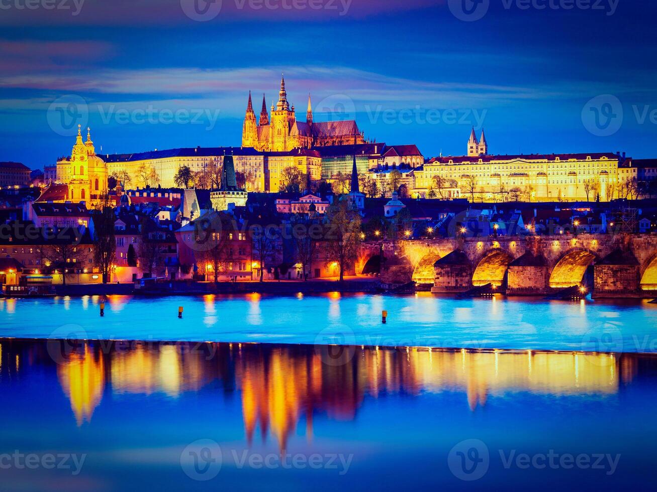 View of Charles Bridge and Prague Castle in twilight photo