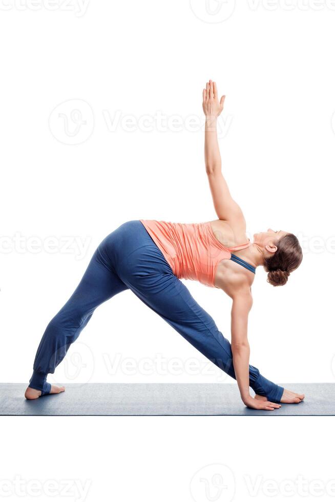 Sporty woman practices Ashtanga Vinyasa yoga asana photo