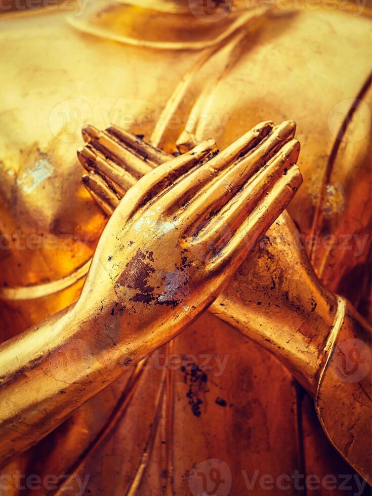 Buddha statue hands close up photo