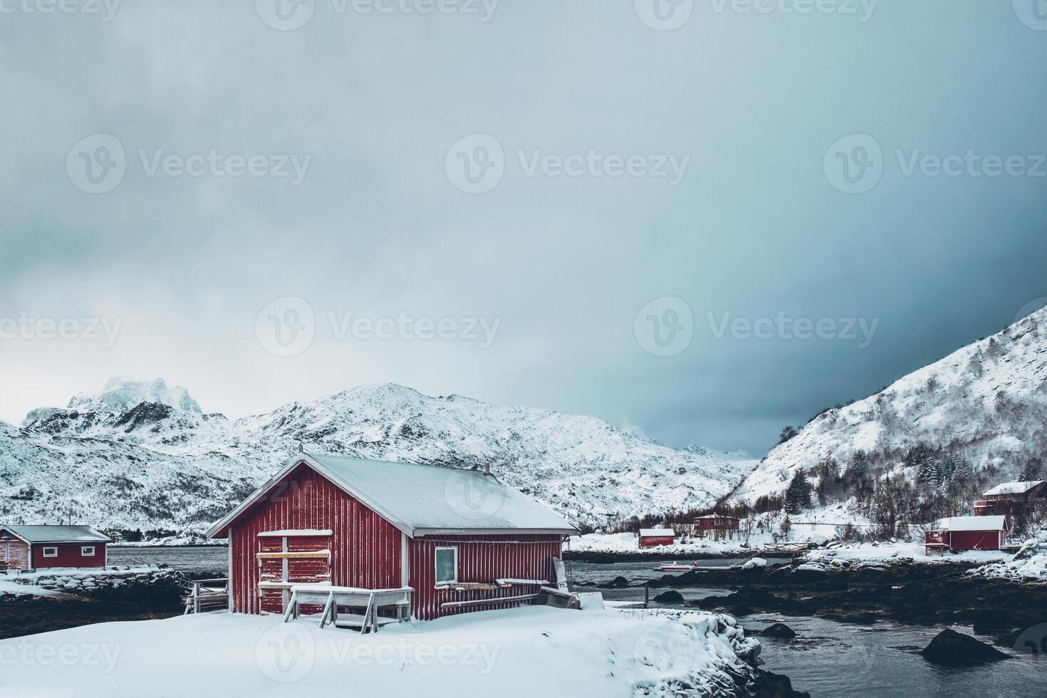 Red rorbu house in winter, Lofoten islands, Norway photo