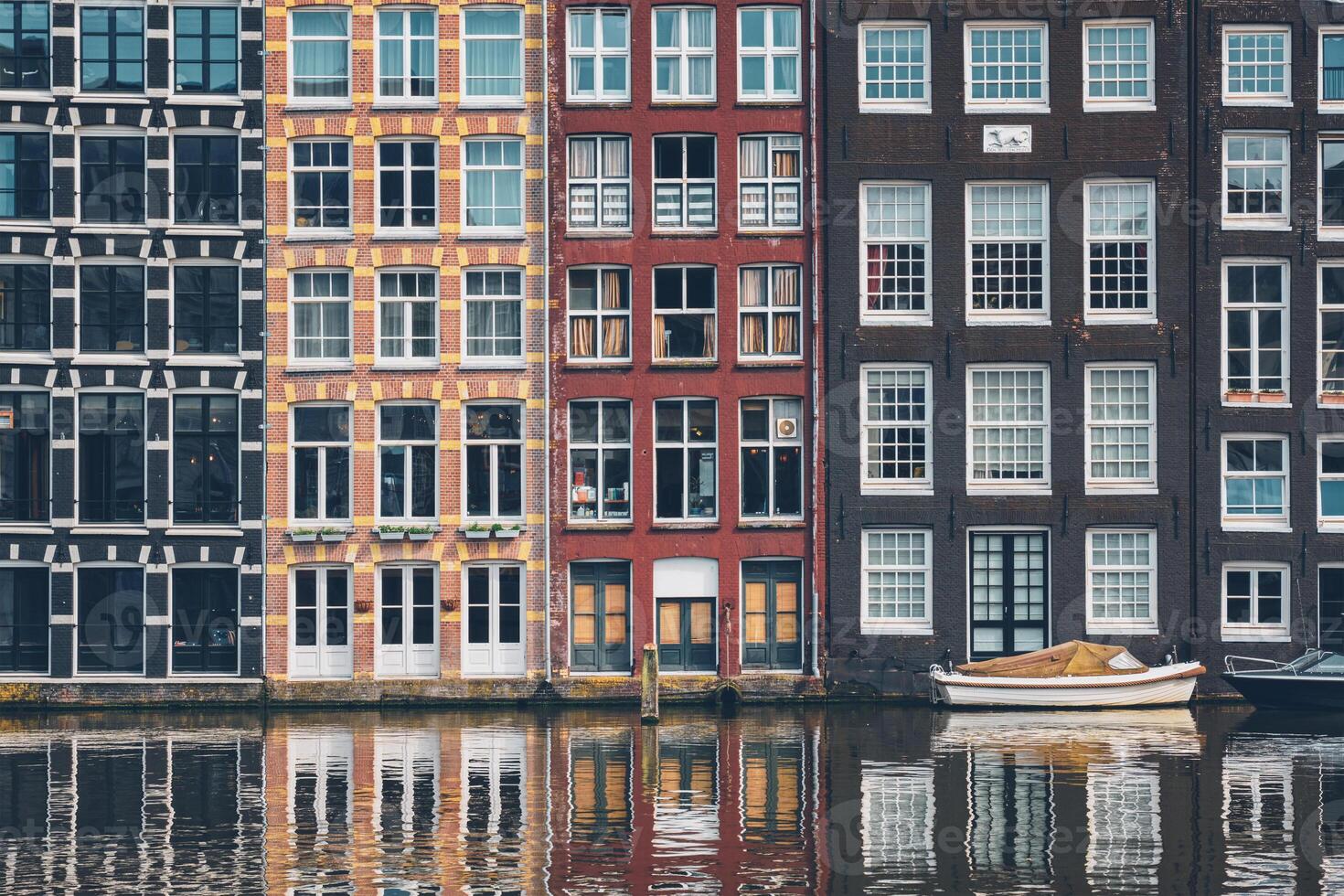 Amsterdam canal Damrak with houses, Netherlands photo