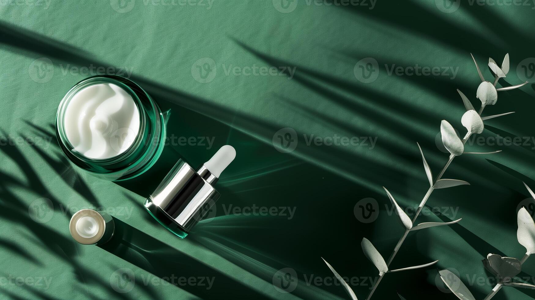 A dark green background with skincare products placed on it, surrounded by sunlight. photo