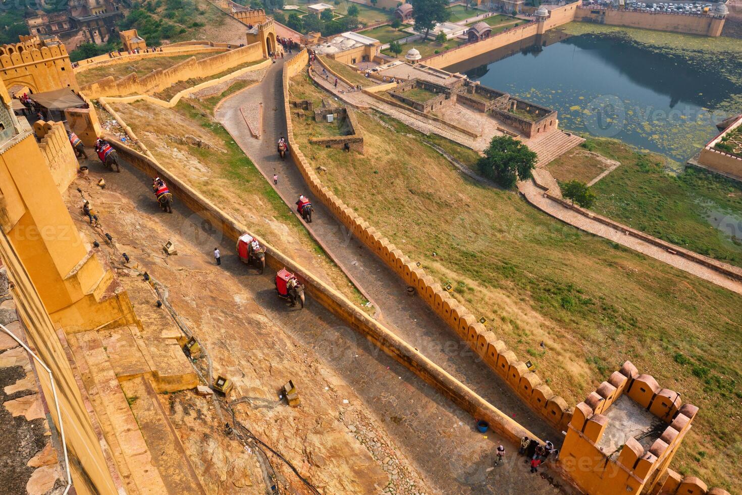 Tourists riding elephants on ascend to Amer fort photo