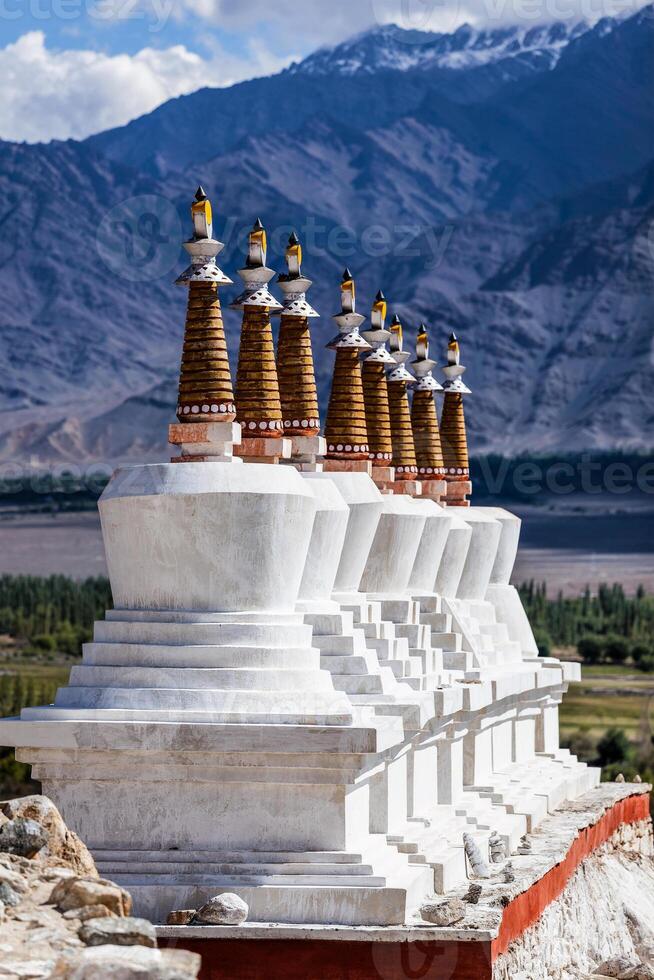 Buddhist chortens stupas in Himalayas. photo