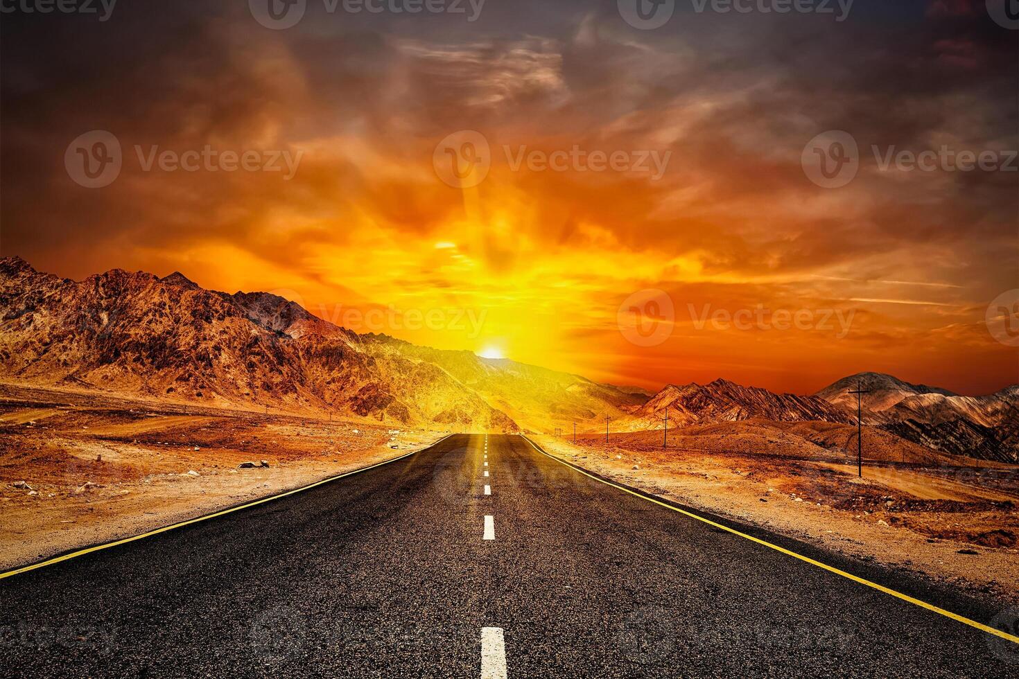 Road in Himalayas with mountains photo