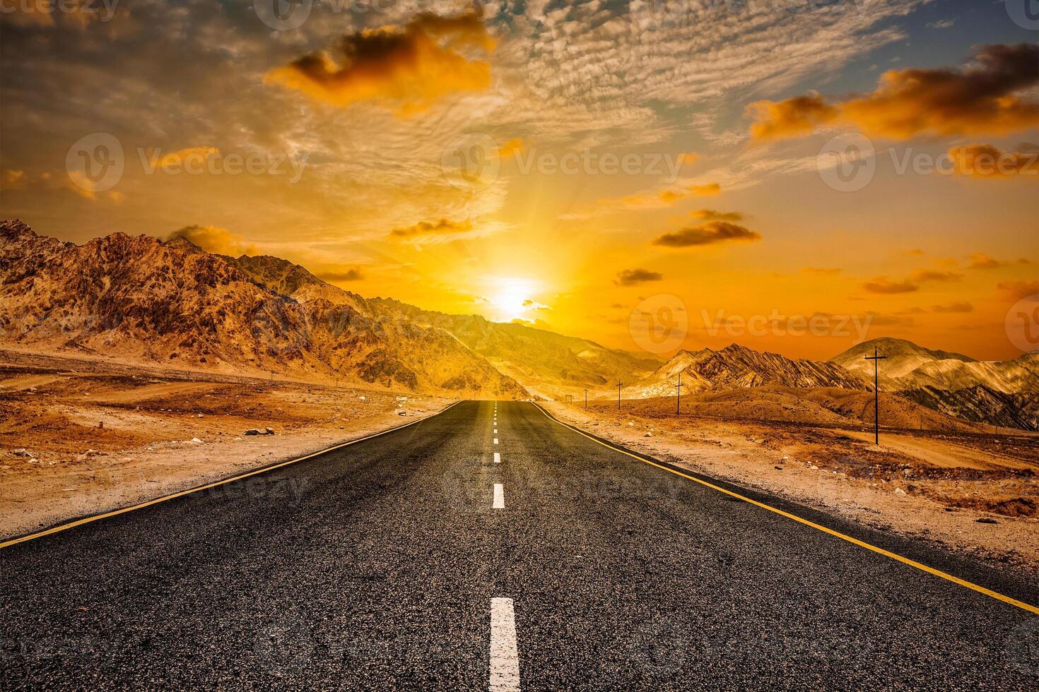 Road in Himalayas with mountains photo