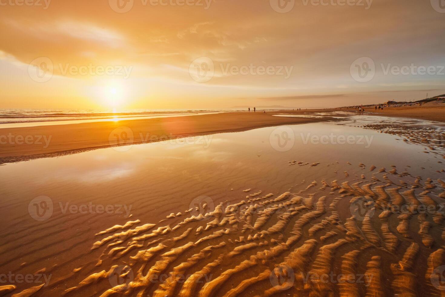 Atlantic ocean sunset with surging waves at Fonte da Telha beach, Portugal photo