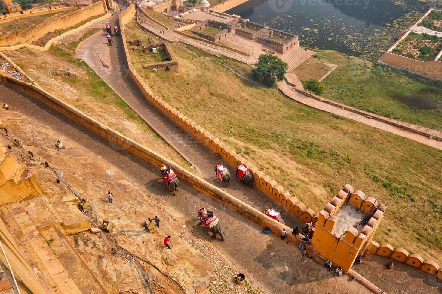 Tourists riding elephants on ascend to Amer fort photo