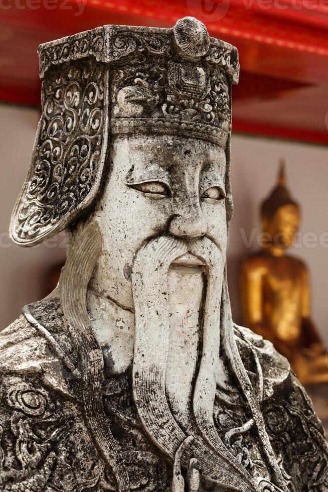 Wat Pho stone guardian face close up, Thailand photo