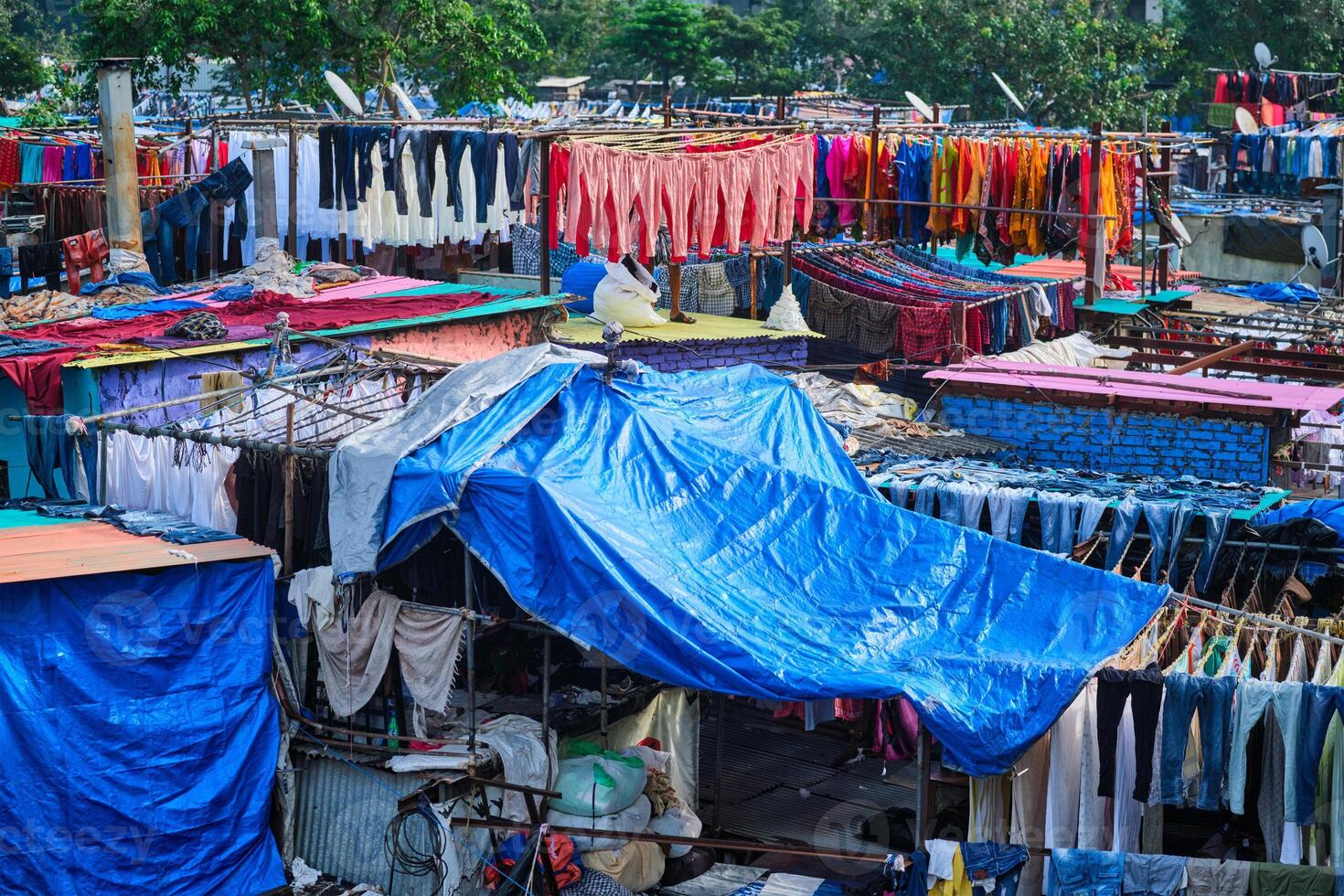 Dhobi Ghat is an open air laundromat lavoir in Mumbai, India with laundry drying on ropes photo