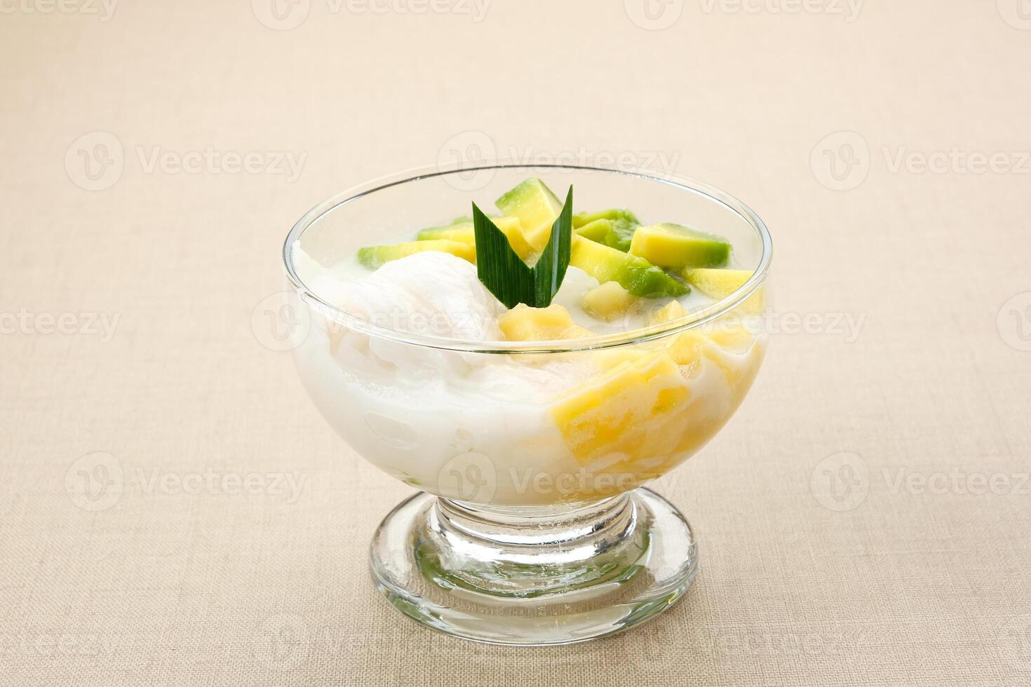 Es teler or es teller, Indonesian dessert, consist of avocado, young coconut, jackfruit, served with coconut milk or sweetened condensed milk. photo