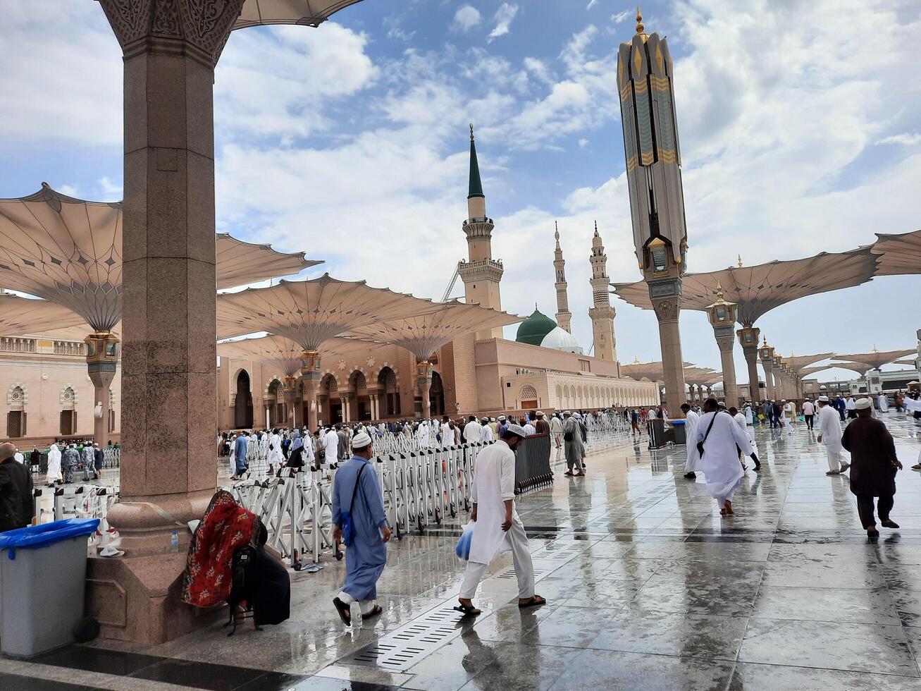 Madinah, Saudi Arabia, 29 March 2024 - Beautiful daytime outdoor view of Prophet's Mosque Madinah in dark clouds and rain. photo
