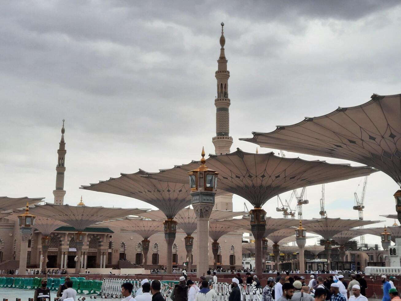 Madinah, Saudi Arabia, 29 March 2024 - Beautiful daytime outdoor view of Prophet's Mosque Madinah in dark clouds and rain. photo