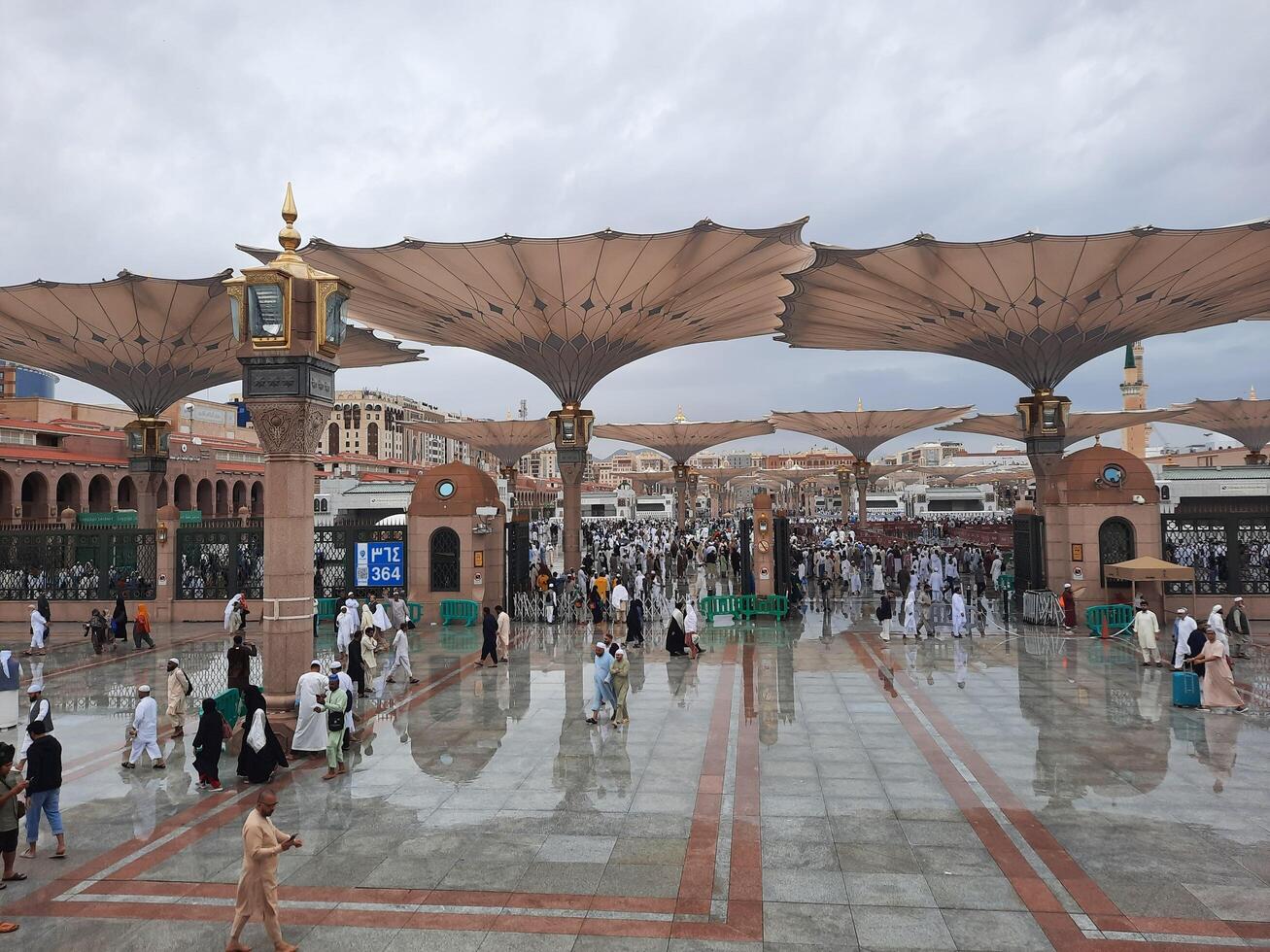 Madinah, Saudi Arabia, 29 March 2024 - Beautiful daytime outdoor view of Prophet's Mosque Madinah in dark clouds and rain. photo