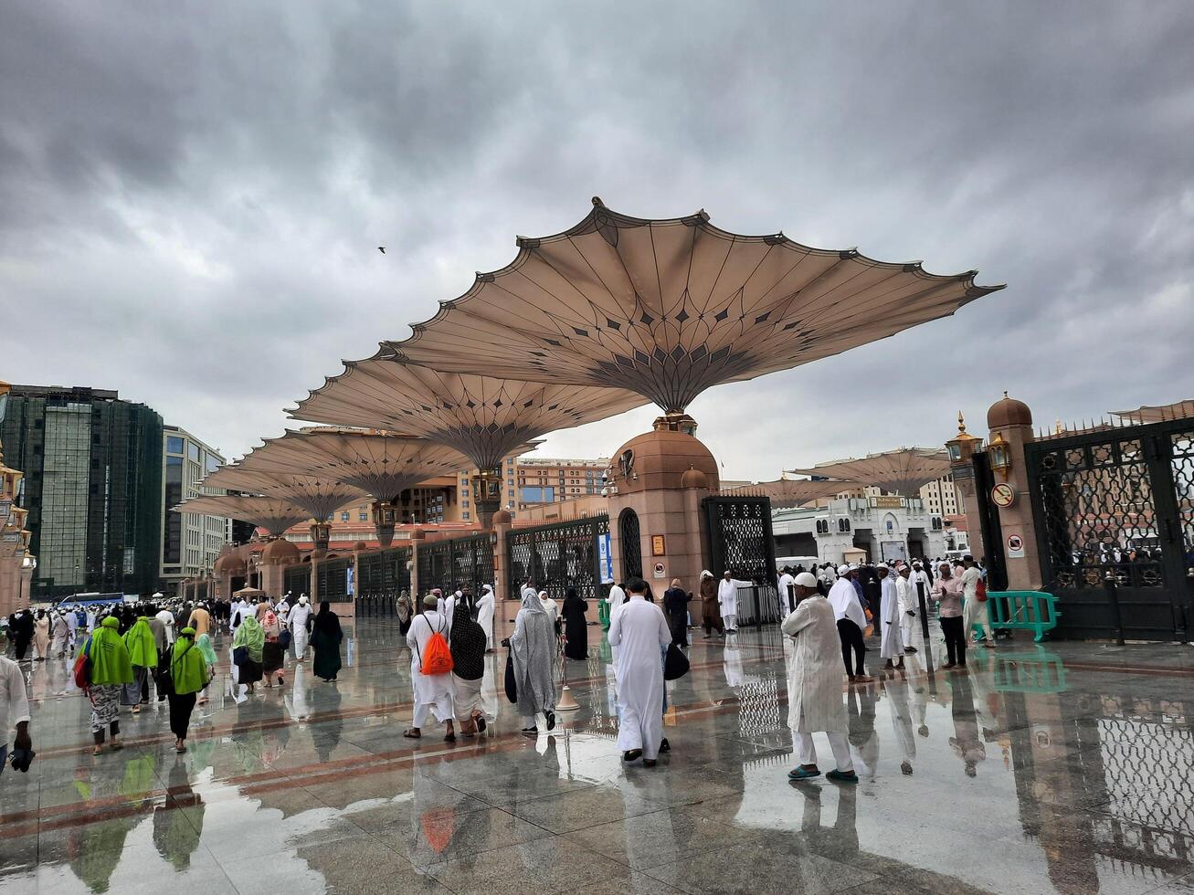 Madinah, Saudi Arabia, 29 March 2024 - Beautiful daytime outdoor view of Prophet's Mosque Madinah in dark clouds and rain. photo