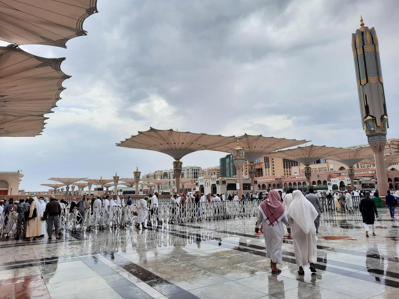 Madinah, Saudi Arabia, 29 March 2024 - Beautiful daytime outdoor view of Prophet's Mosque Madinah in dark clouds and rain. photo
