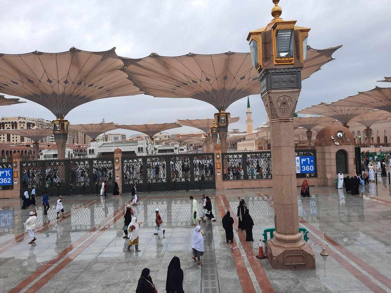 Madinah, Saudi Arabia, 29 March 2024 - Beautiful daytime outdoor view of Prophet's Mosque Madinah in dark clouds and rain. photo
