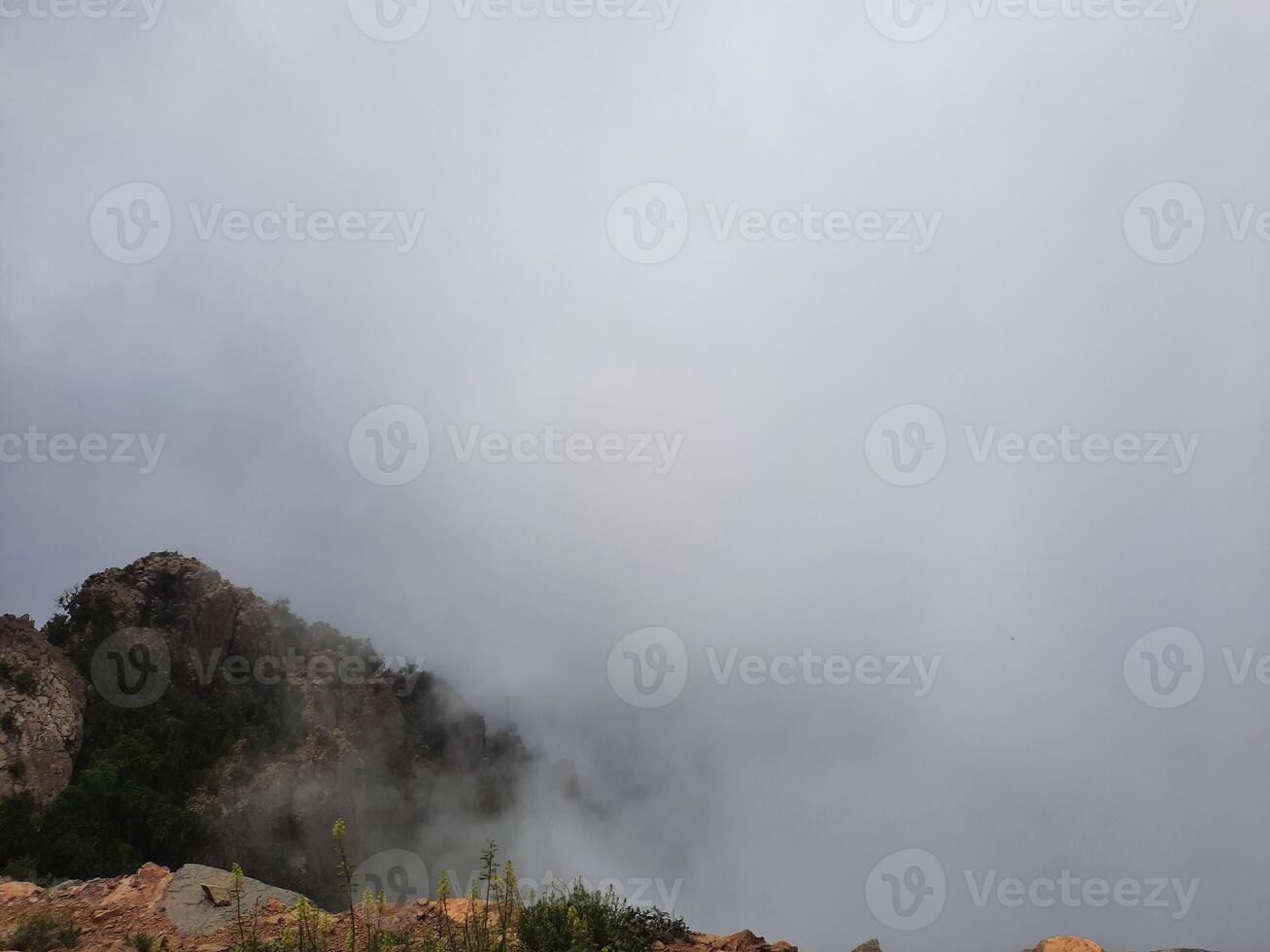 Breathtaking natural beauty of Abha in Saudi Arabia in the summer season. High mountains, greenery, low clouds and fog are the beauty of Abha. photo
