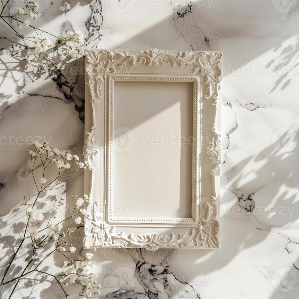 A white picture frame with an empty space inside, sitting on top of a marble surface. photo
