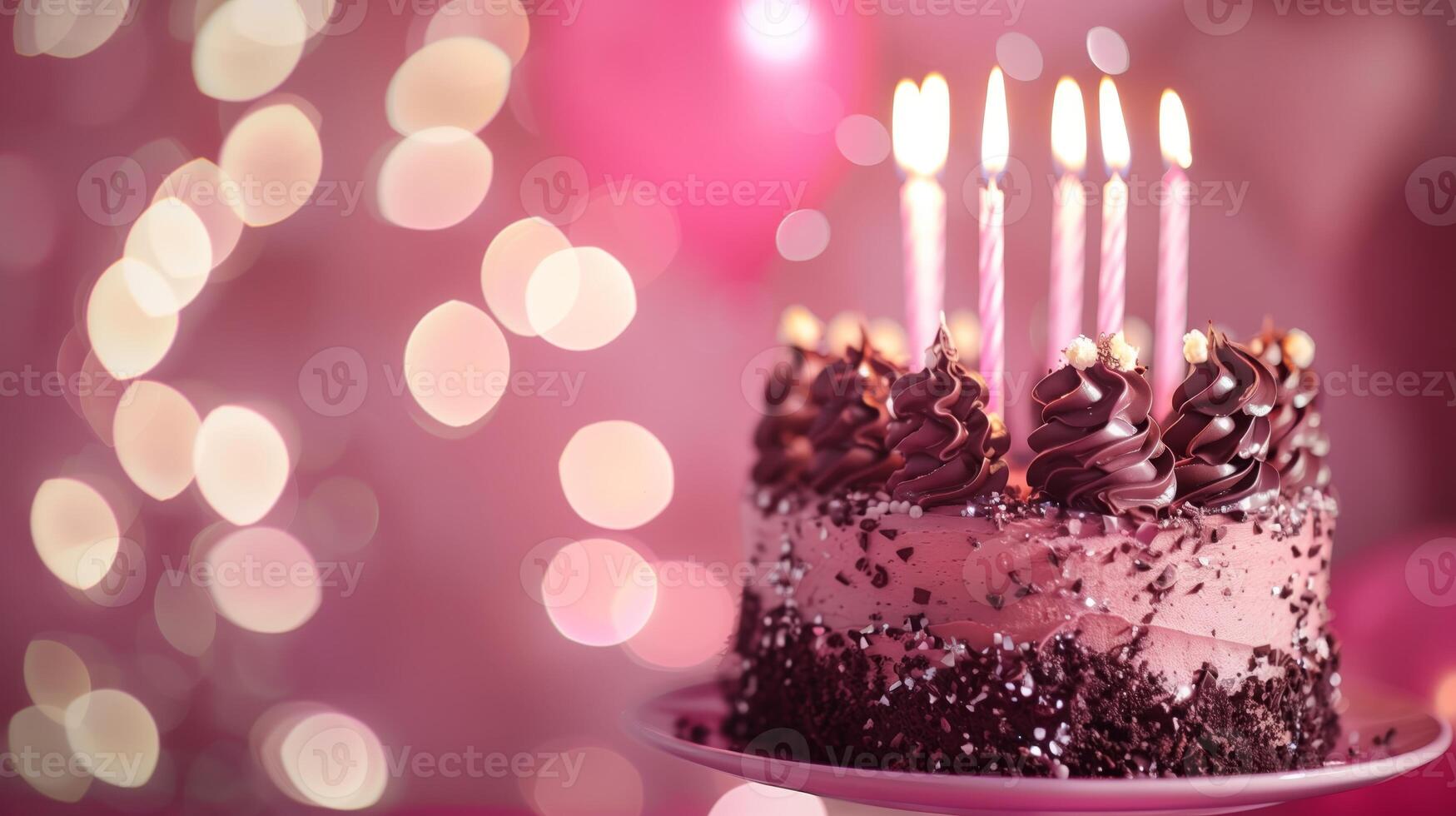 A Birthday chocolate layer cake with candles and pink background. photo