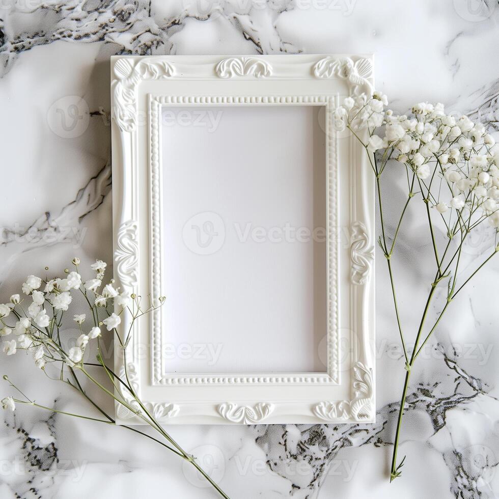 A white picture frame with an empty space inside, sitting on top of a marble surface. photo