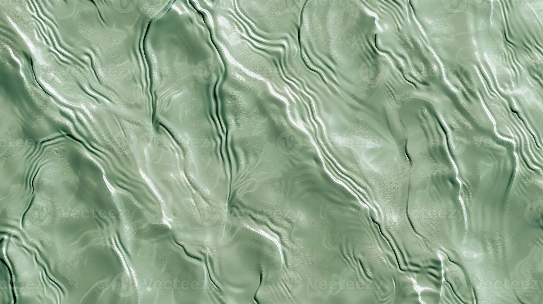 A texture of ripples on sand, with small waves on the surface, light green tint. photo