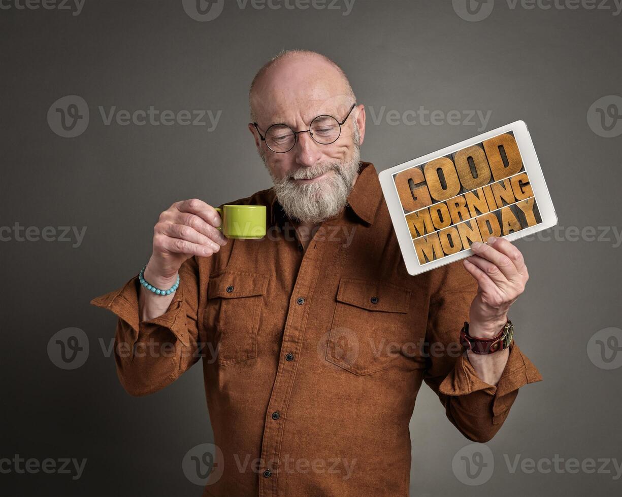 senior man with Good Morning Monday sign photo