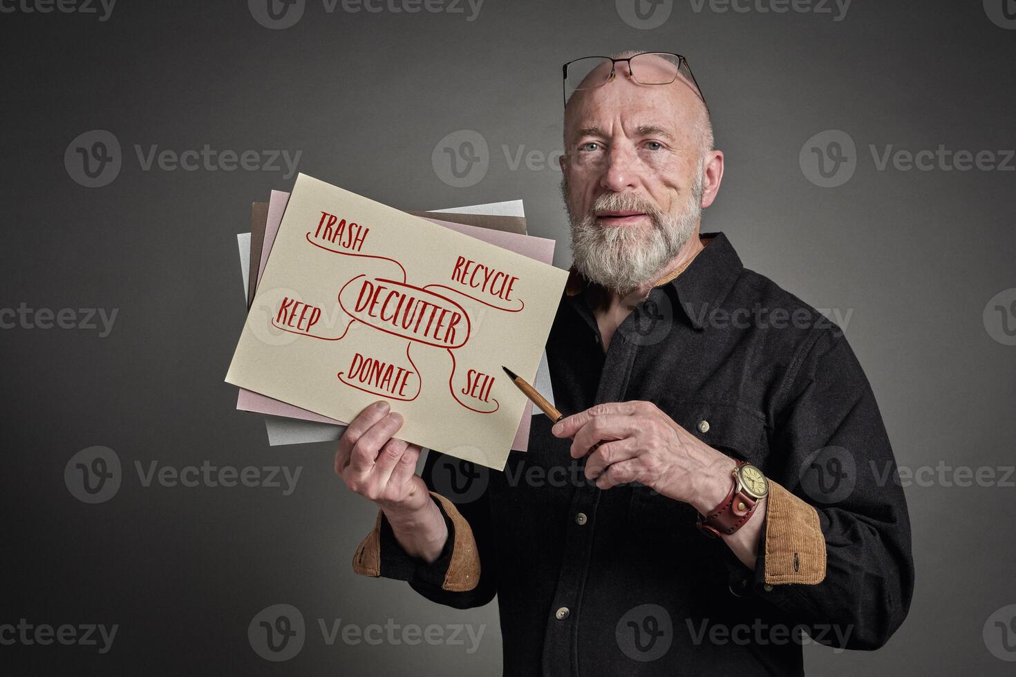 senior man is presenting declutter mind map photo