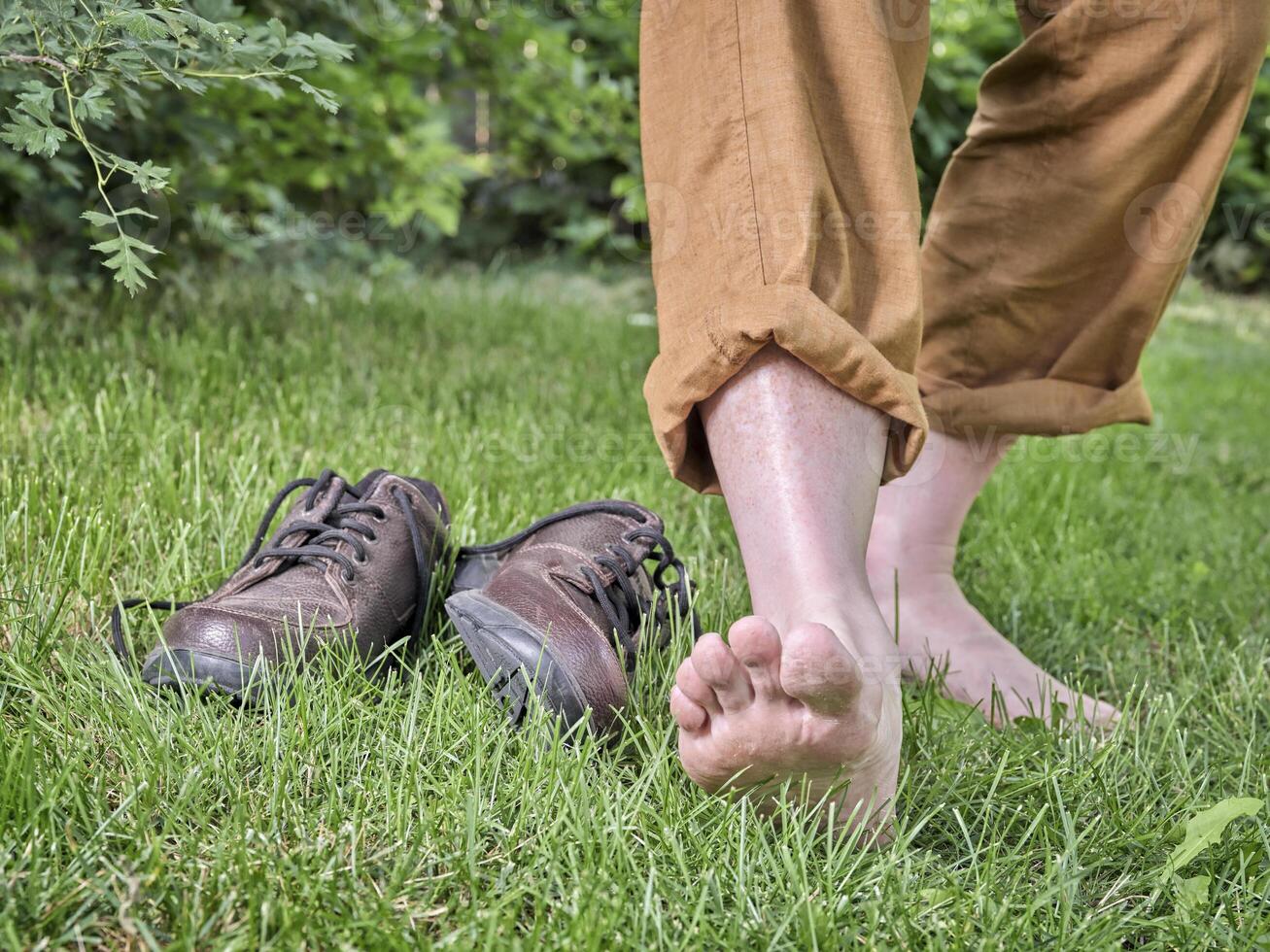 Barefoot walking, earthing and grounding concept photo