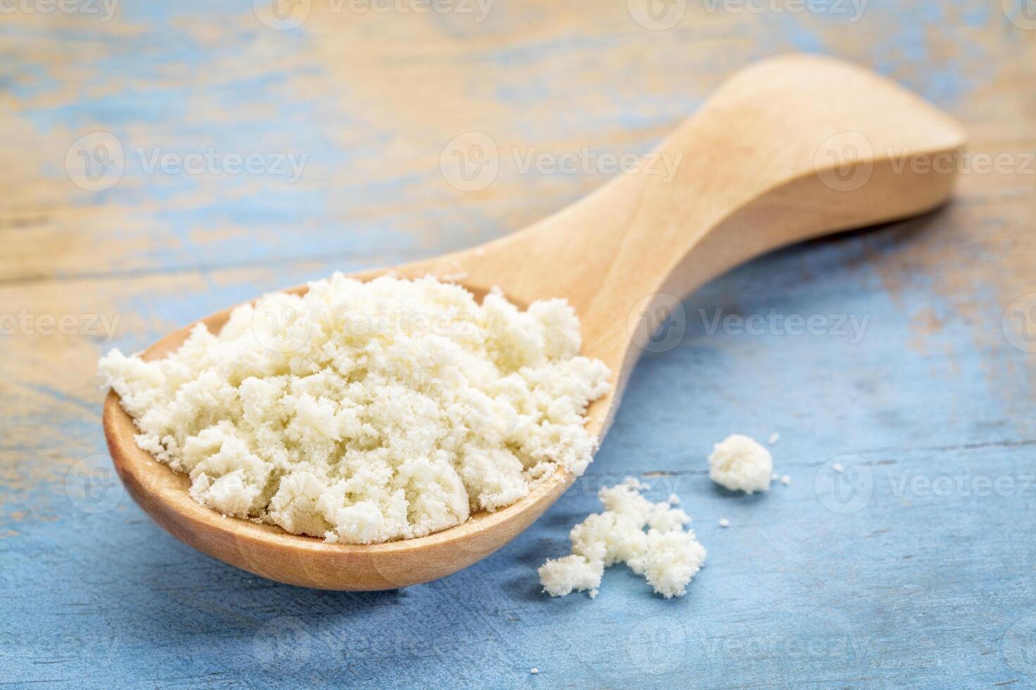 spoon of whey protein powder photo