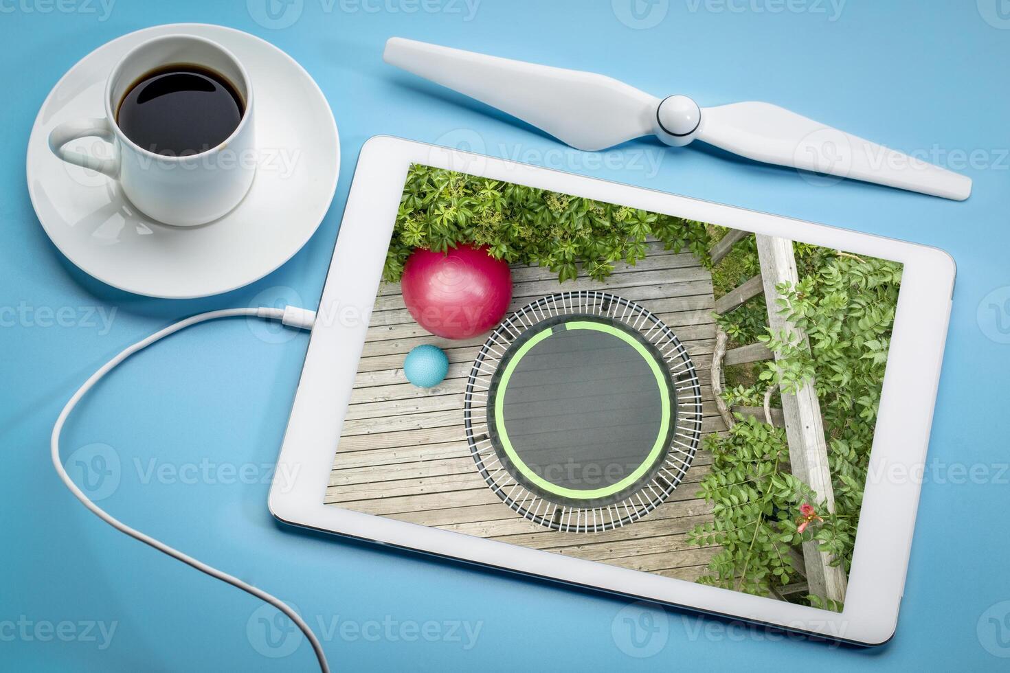 mini fitness trampoline and exercise ball in backyard patio photo