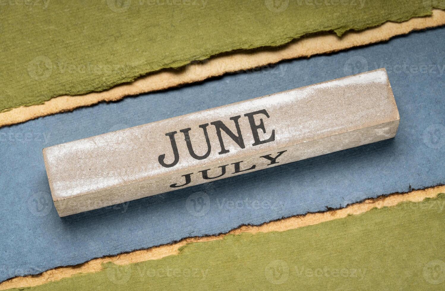 June text on grunge wooden block photo