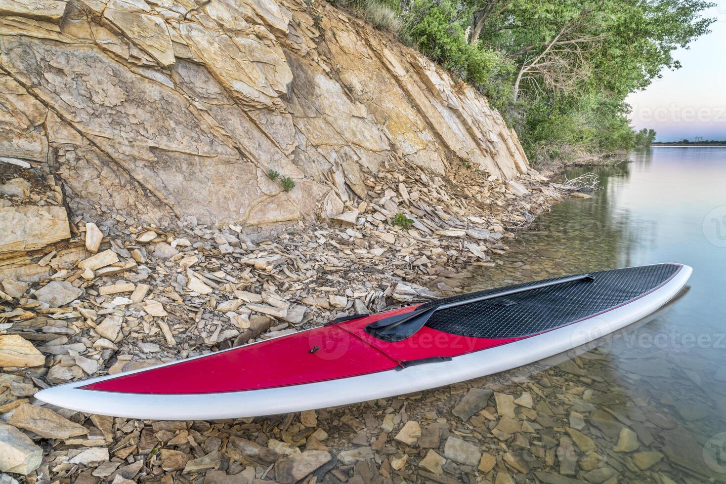 stand up paddleboard on lake photo