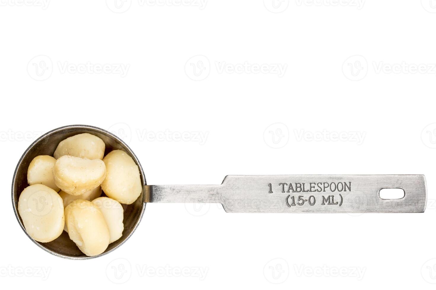 macadamia nuts in a tablespoon photo