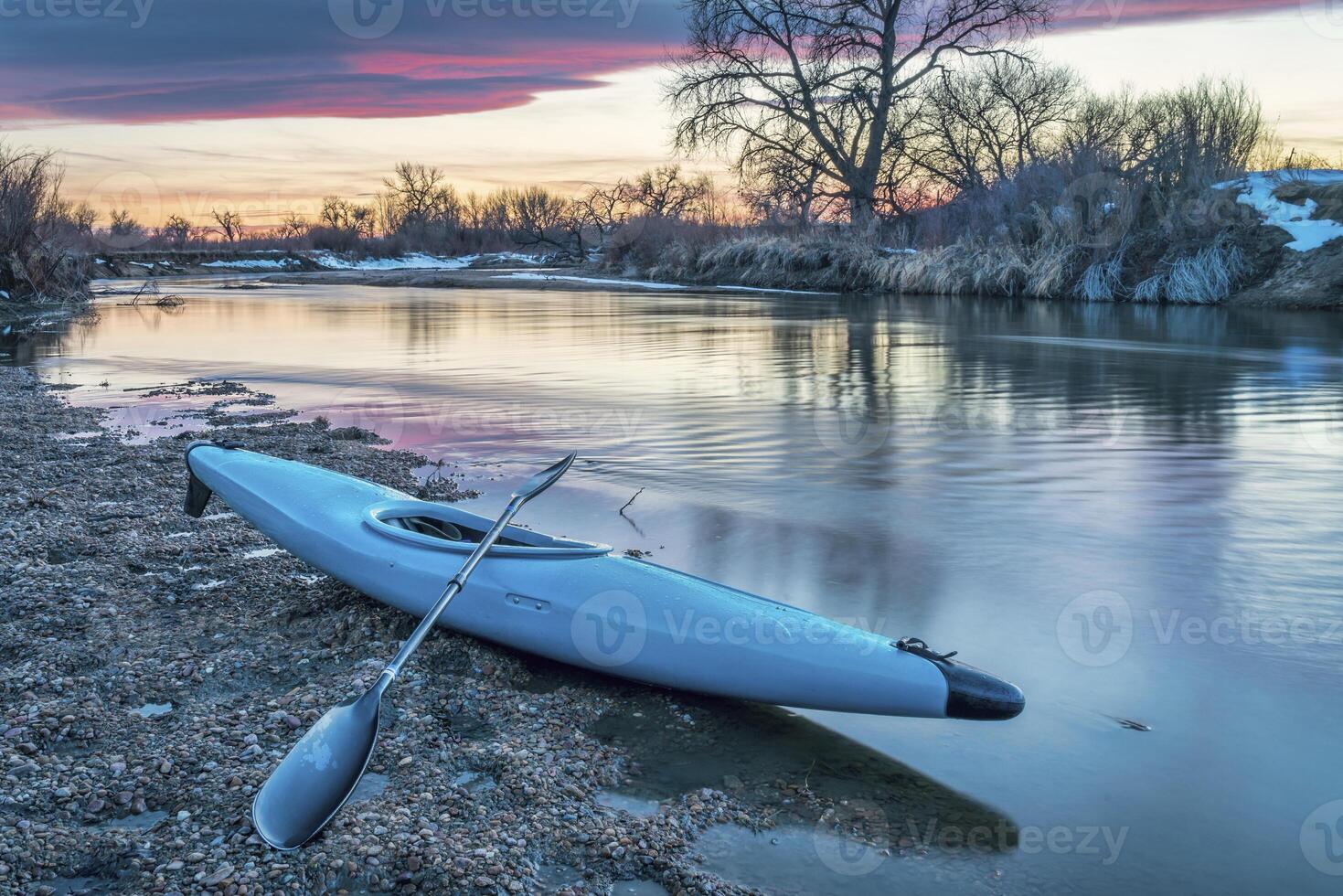 kayak and river at dusk photo
